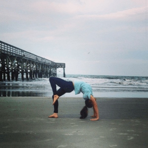 Me doing a modified wheel pose at the beach 